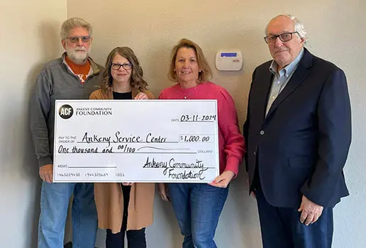Representatives of the Ankeny Service Center accept a $1,000 grant check from the Ankeny Community Foundation
