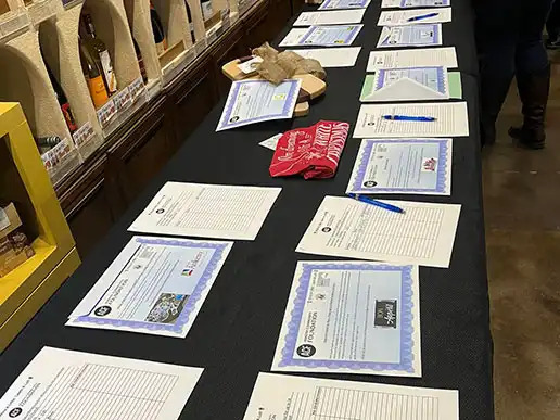 A silent auction table at the Ankeny Community Foundation's 