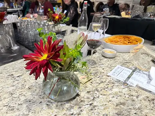 Table decor, drinks, and food at the Ankeny Community Foundation's 