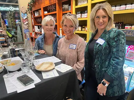 A group of women smiling at the Ankeny Community Foundation's 