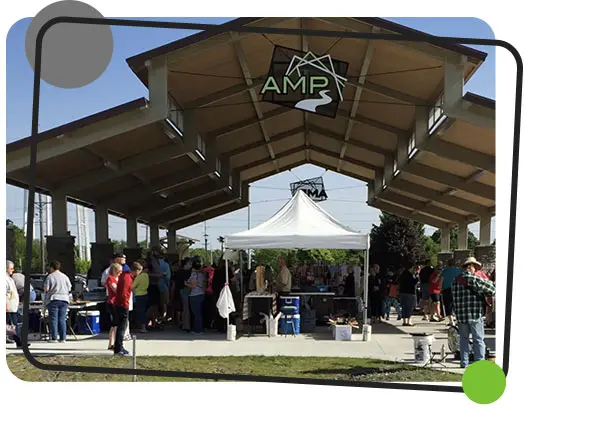A crowd and vendors congregate at the Ankeny Market & Pavilion