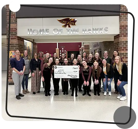 Students at Ankeny High School hold up a $500 check from the Ankeny Community Foundation